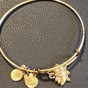 Ladies yellow gold tone Alex and Ani bracelet